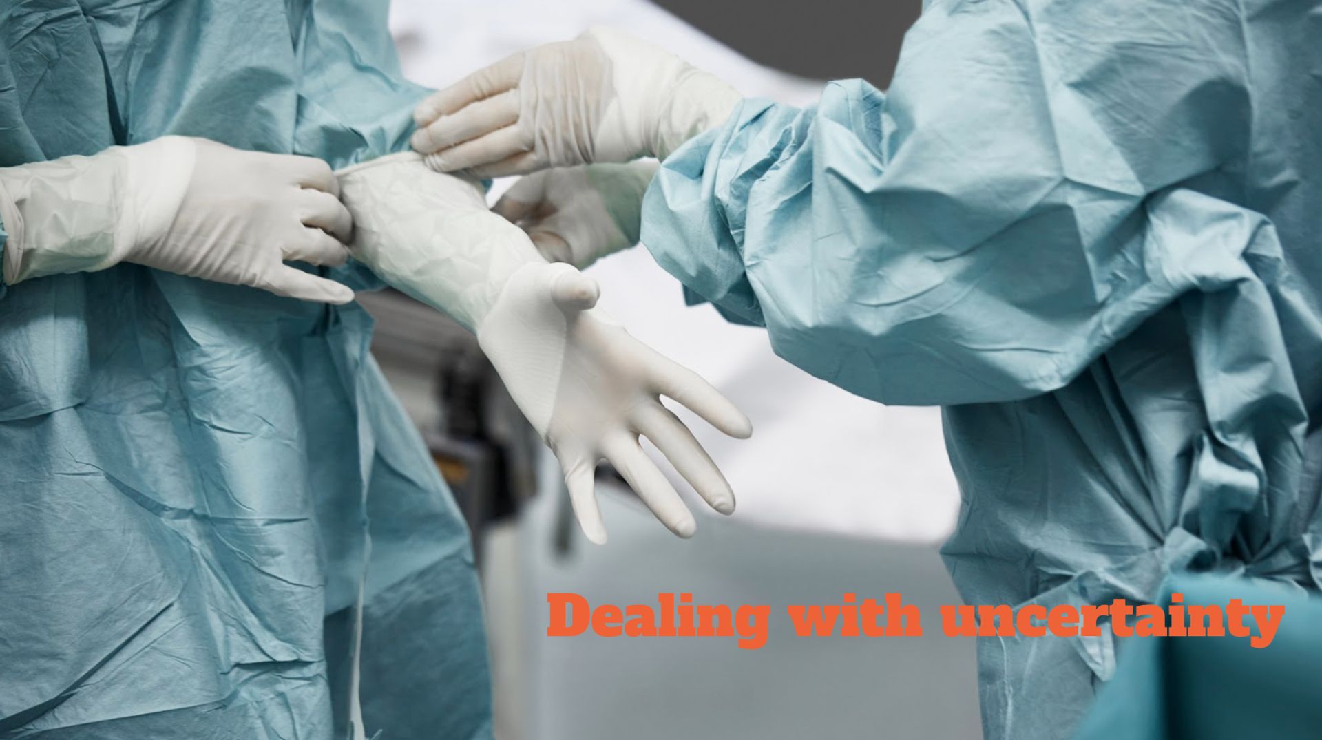 Photo of surgeons putting on medical gloves