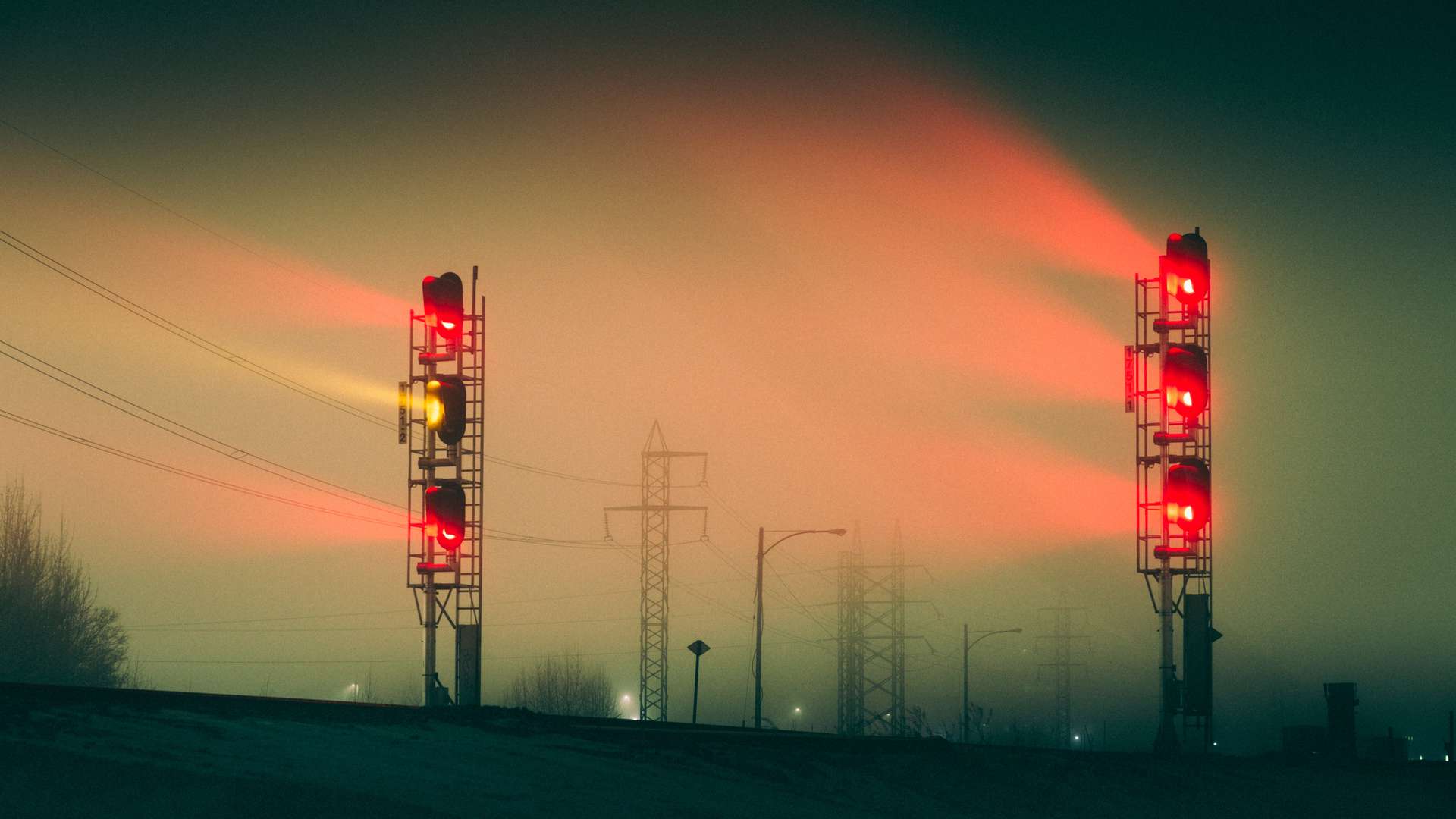 Foggy train lights showing red and yellow signals